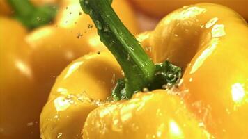 Drops of water fall on sweet peppers. Macro shot. Filmed on a high-speed camera at 1000 fps. High quality FullHD footage video