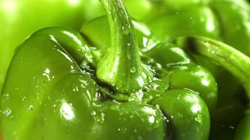 Drops of water fall on sweet peppers. Macro shot. Filmed on a high-speed camera at 1000 fps. High quality FullHD footage video