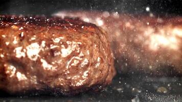 The burger is fried in a pan. Macro shot. Filmed on a high-speed camera at 1000 fps. High quality FullHD footage video