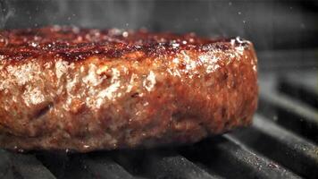 The burger is fried in a pan. Macro shot. Filmed on a high-speed camera at 1000 fps. High quality FullHD footage video