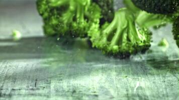 Dropping broccoli with splashing water. Filmed on a high-speed camera at 1000 fps. High quality FullHD footage video