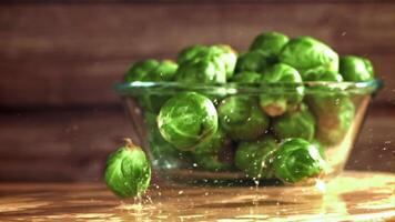 Brussels sprouts fall on the table. Filmed on a high-speed camera at 1000 fps. High quality FullHD footage video