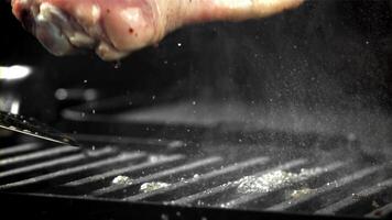 The chicken leg falls into the pan. Filmed on a high-speed camera at 1000 fps. High quality FullHD footage video