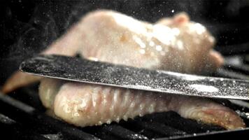 Chicken wing are fried in a pan. Filmed on a high-speed camera at 1000 fps. High quality FullHD footage video