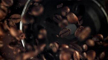 Coffee beans in a working grinder. Filmed on a high-speed camera at 1000 fps. High quality FullHD footage video