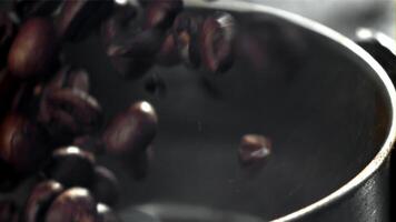 Coffee beans in a working grinder. Filmed on a high-speed camera at 1000 fps. High quality FullHD footage video