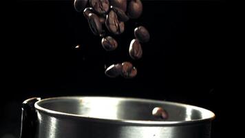 The coffee beans fall into the working grinder. Filmed on a high-speed camera at 1000 fps. High quality FullHD footage video