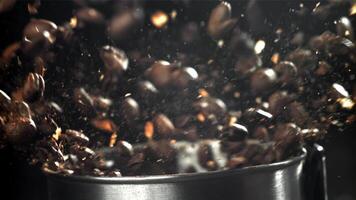 Coffee beans in a working grinder. Filmed on a high-speed camera at 1000 fps. High quality FullHD footage video