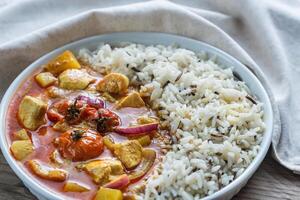 Thai yellow curry with chicken and rice photo