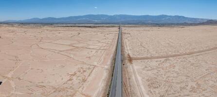 Classic panorama view of an endless straight road photo