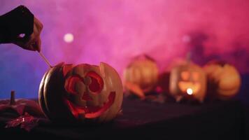 Set fire to pumpkin for halloween. 4K. Stock video. Halloween video