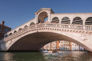 Iconic Rialto Bridge in Venice, Italy - Popular Landmark for Tourists and Locals photo