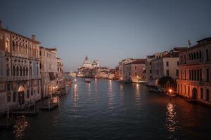 Serene Dusk View of Venice Waterway with Unique Architecture and Calm Atmosphere photo