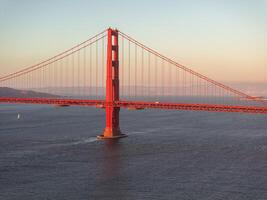 Famous Golden Gate Bridge, San Francisco at sunset, USA photo