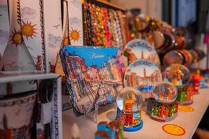 Venetian Souvenirs Displayed in Well-Lit Travel Store Interior photo