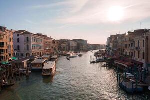 Tranquil Grand Canal in Venice, Italy with Boats Cruising - Serene and Picturesque Scene photo