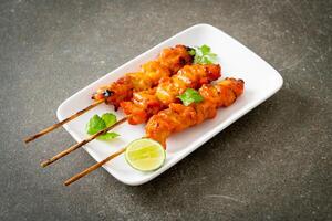 grilled chicken skewer with herbs and spices photo