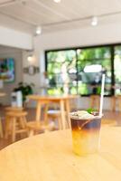 lemon with black coffee in glass photo