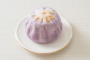 taro bun with white sugar cream and nut photo