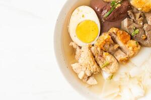 paste of rice flour or boiled Chinese pasta square in clear soup photo