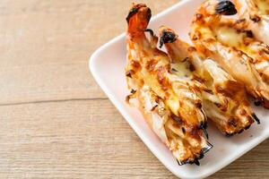 grilled river prawns or shrimps with cheese photo