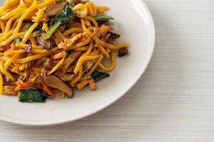 stir-fried yakisoba noodles with vegetable in vegan style photo