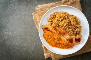 grilled chicken steak with red curry sauce and rice photo