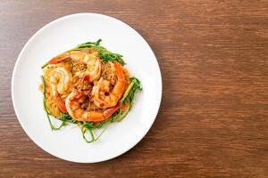 Stir-fried rice vermicelli and water mimosa with shrimps photo