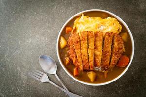 curry rice with fried pork cutlet and creamy omelet photo