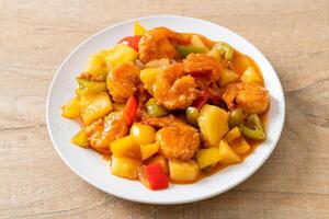 Stir-fried sweet and sour with fried shrimp photo