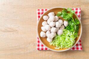 pork meatball with vegetable and spicy sauce photo