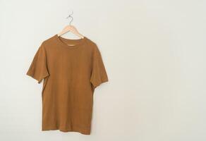 t-shirt hanging with wood hanger photo