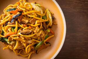 stir-fried yakisoba noodles with vegetable in vegan style photo