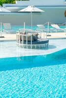umbrella with bed pool around swimming pool photo