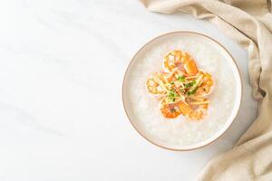 Congee with shrimps and fresh ginger photo