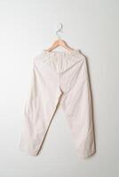 trousers or long pants hanging on wall photo