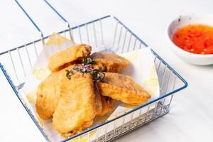 fried chicken wings with sauce photo
