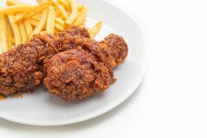 spicy Korean fried chicken with french fries photo