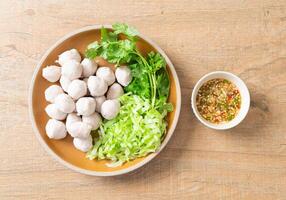 pork meatball with vegetable and spicy sauce photo