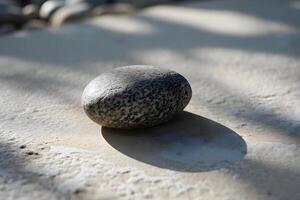 AI generated a rock sitting on top of a sandy beach photo