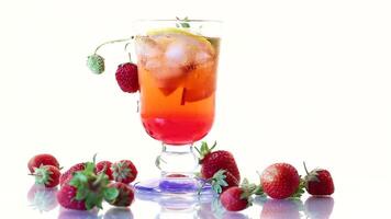 refreshing cool strawberry lemonade with lemon, ice and mint in a glass video