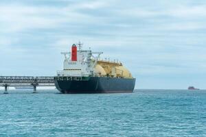 liquefied natural gas tanker vessel during loading at an LNG offshore terminal photo