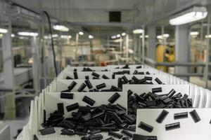 sliced fruit pastilles on the conveyor of a confectionery factory against a blurry workshop background photo