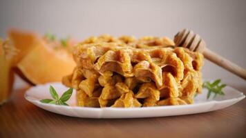 sweet baked pumpkin waffles with honey in a plate video