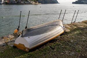 Dartmouth, Devon, UK - January 14. Upturned rowing boat by the River Dart in Dartmouth, Devon on January 14, 2024 photo