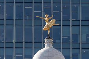 LONDON, UK, MARCH 21.  Replica Statue of Anna Pavlova on the Cupola of the Victoria Palace Theatre in London on March 21, 2018 photo