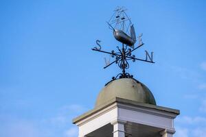 Dartmouth, Devon, UK - January 14. View of a weathervane in Dartmouth, Devon on January 14, 2024 photo