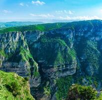 mountain landscape in the Caucasus with rocky cliffs on the slopes of the huge canyon of the Sulak River photo