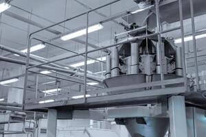 industrial apparatus for packing sweets in the shop of a confectionery factory photo