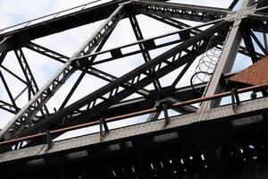 bottom-up view of the railway truss bridge section photo